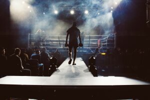 A fighter walking towards the ring.